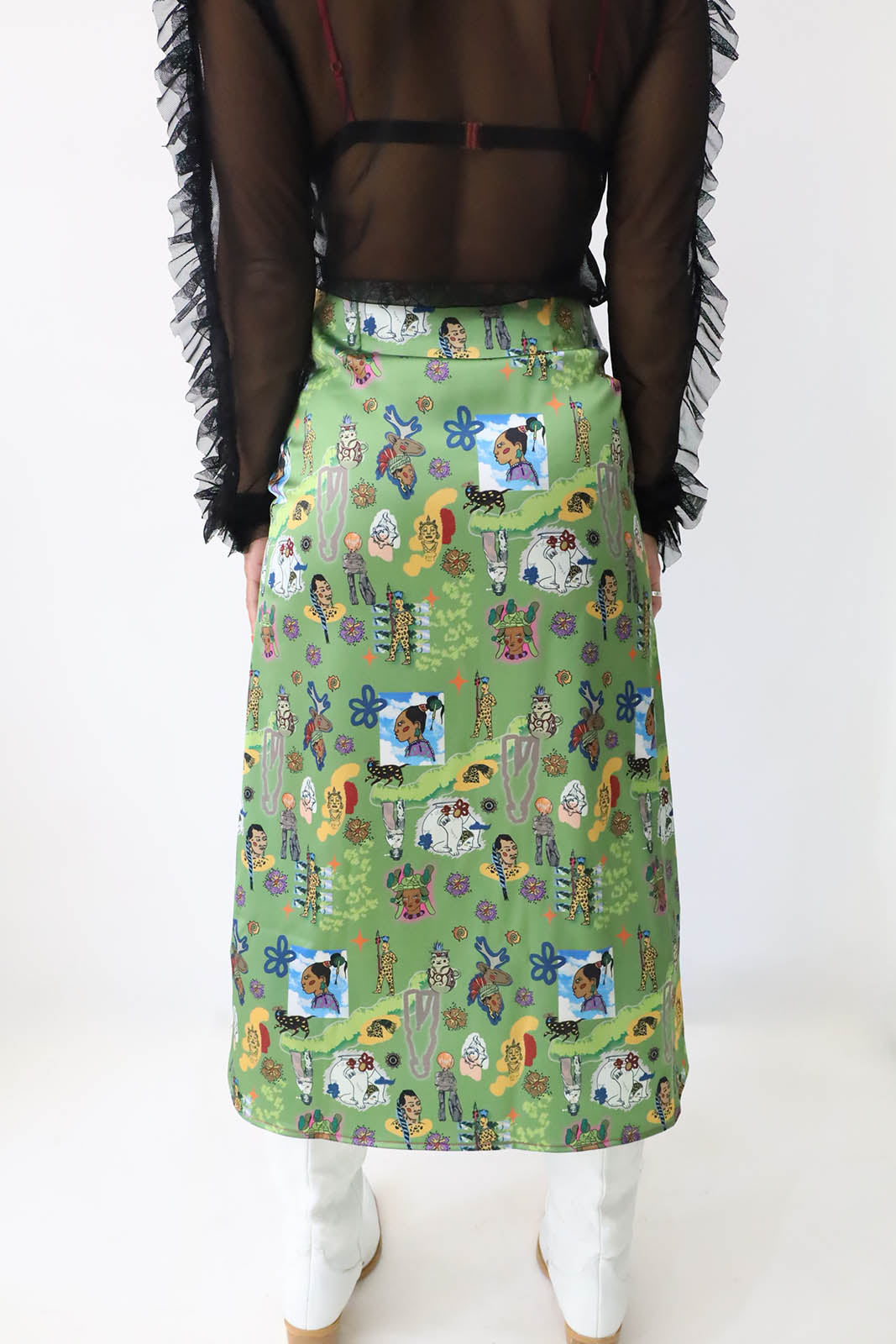 ROMPER Nina midi skirt in black leather — movement shot on model