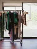 ready to wear hanging from a rack