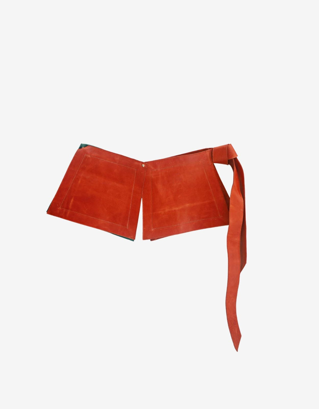 Zadie modular leather belt, back view showing zippered pocket and hand-woven leather tassel